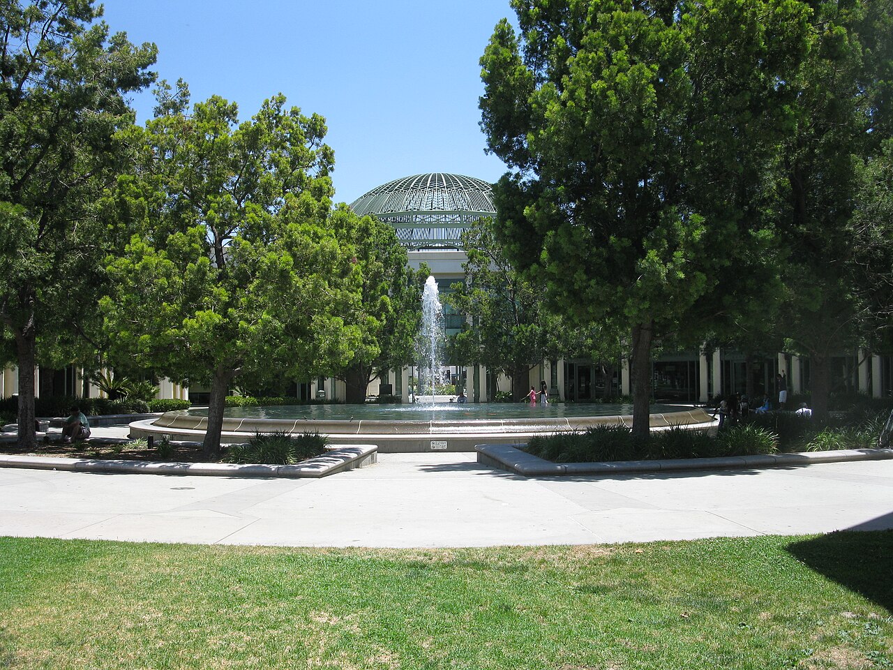 Exterior view of Escondido City Hall with trees and landscaping in front.
