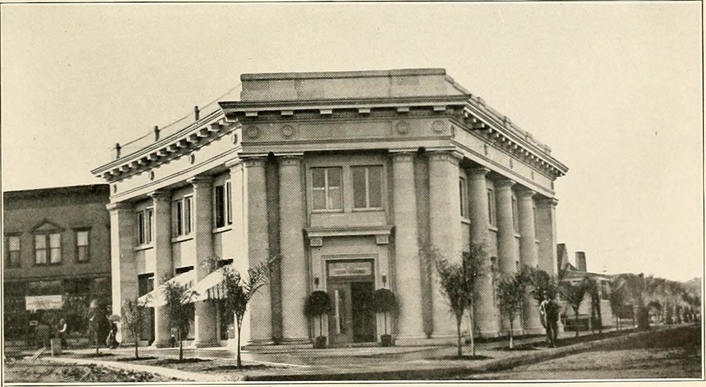 Wide black-and-white image of an early Escondido High School building and its grounds.