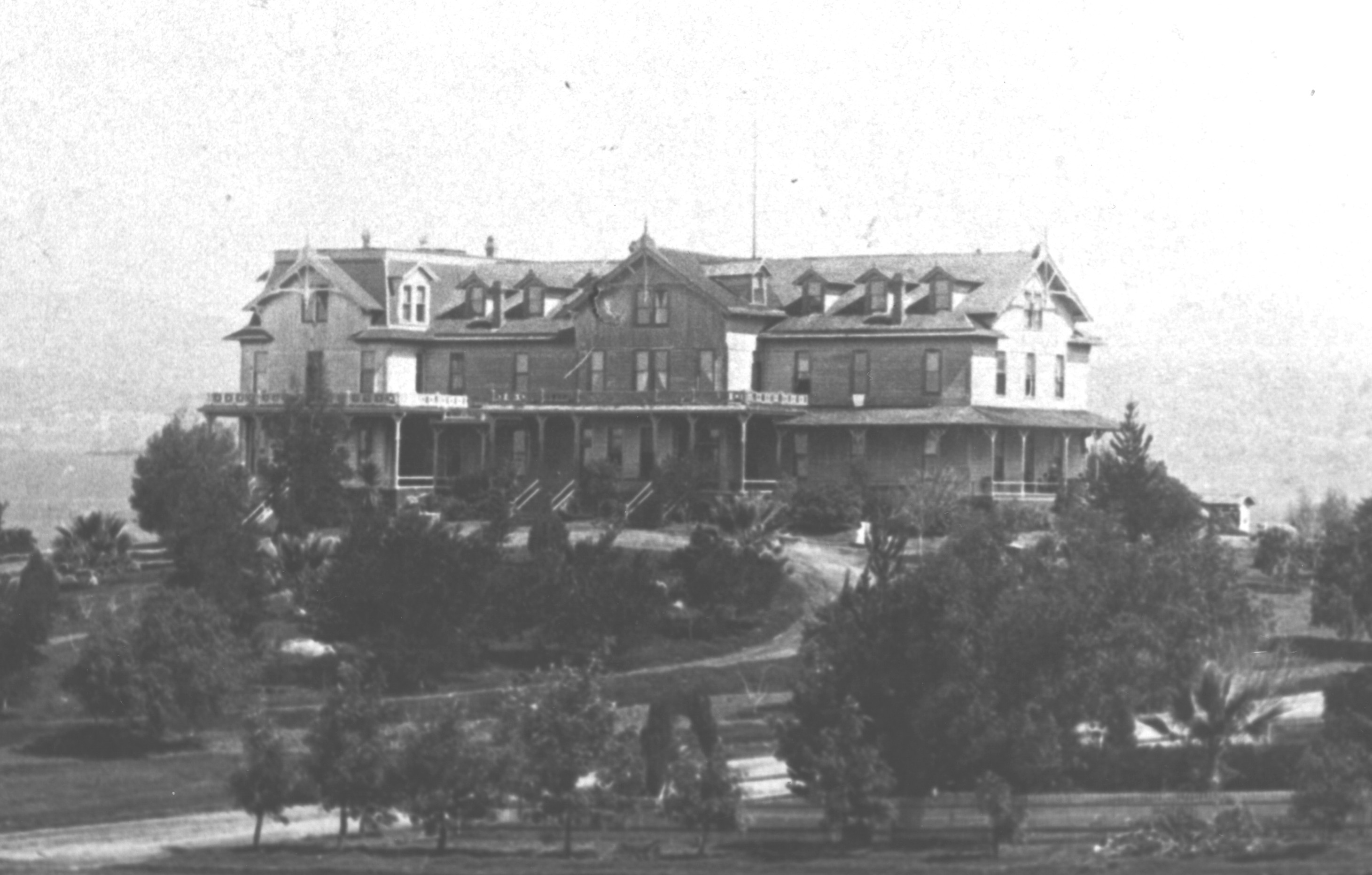 A large Victorian-era hotel on a landscaped hillside.