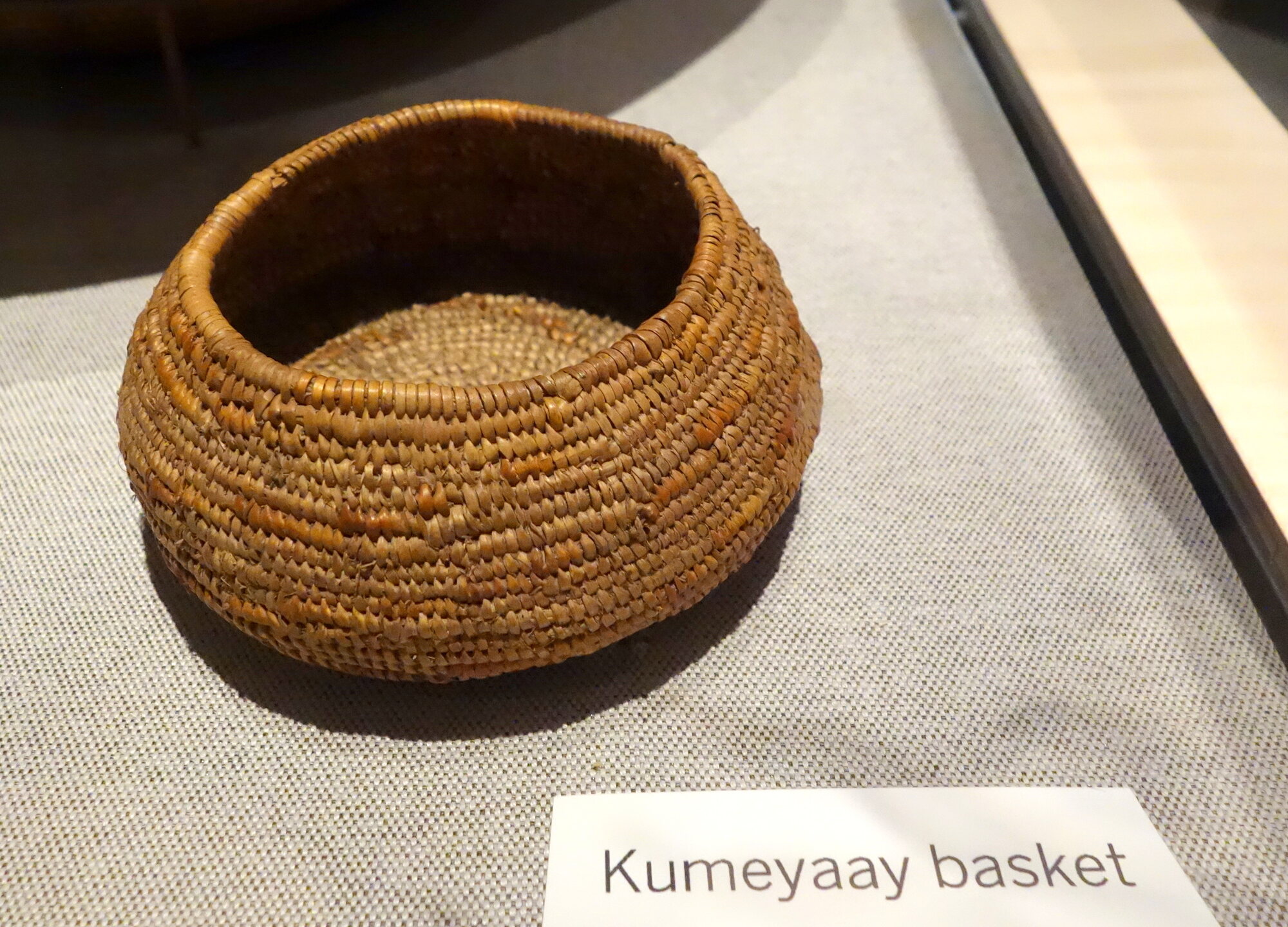 Woven Kumeyaay basket displayed in a museum collection.